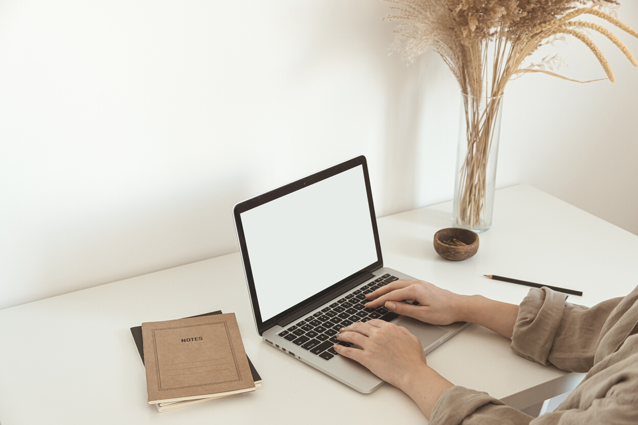 Woman Typing on a Laptop 